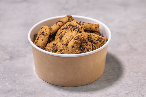 Lovely cookie container and cookies on straw placemat