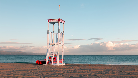 Frontal view of a lifeguard tower in the Poetto beach at sunset