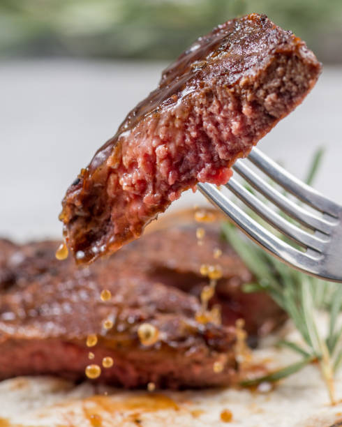 istock Piece of medium-roasted steak on a fork 1471477722