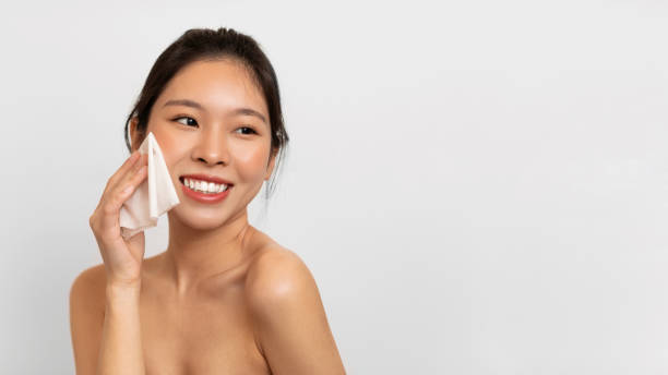 istock Young Asian lady rubbing her face with napkin 1471478091