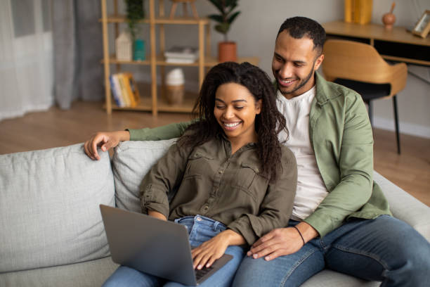 istock Happy African American Couple Using Laptop Computer At Home 1471478278