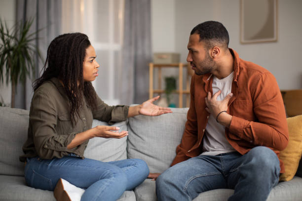 istock Angry Black Couple Having Quarrel Sitting On Sofa At Home 1471478291