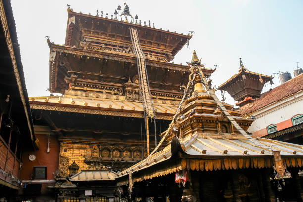 Hiranya Varna Mahavihar (The Golden Temple) buildings exterior in a sunny day in Lalitpur city, Nepal. Soft focus. Religious architecture theme.