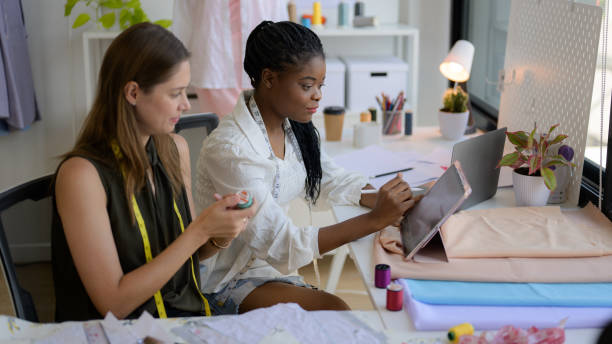 istock Happy female dressmaker working in workshop studio 1471478985