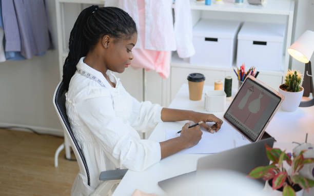 istock Happy female dressmaker working in workshop studio 1471481728