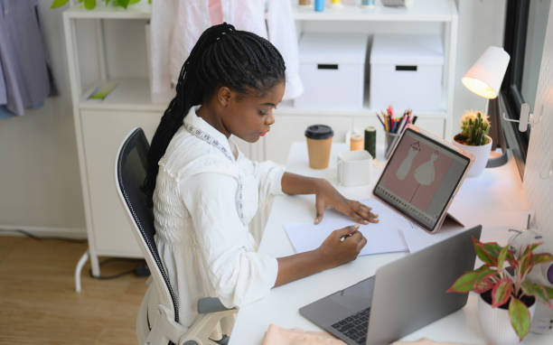istock Happy female dressmaker working in workshop studio 1471481792