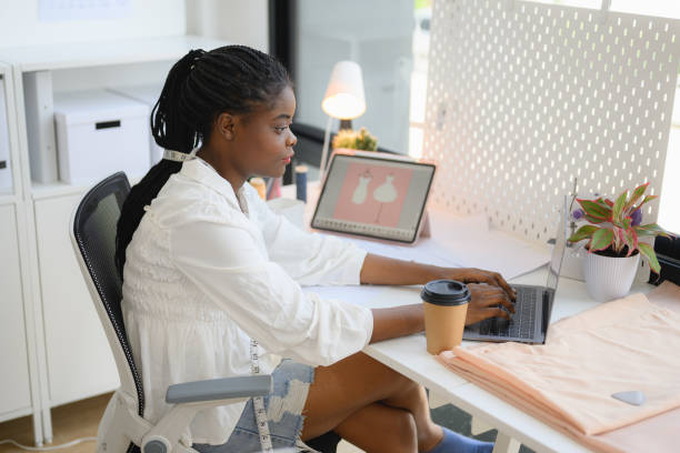 istock Happy female dressmaker working in workshop studio 1471482094