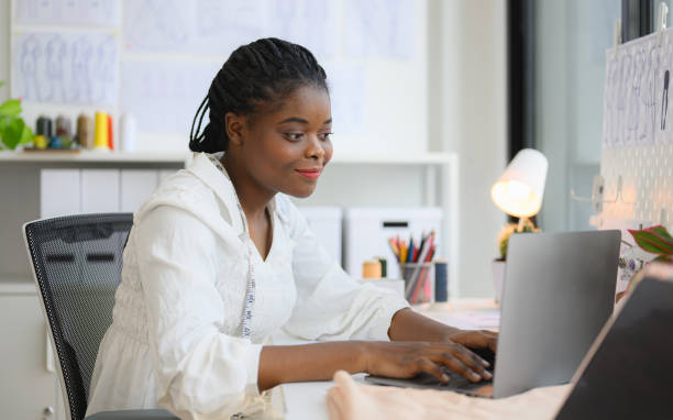 istock Happy female dressmaker working in workshop studio 1471482255