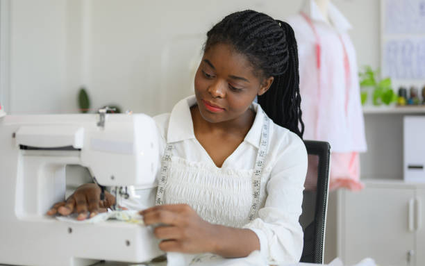 istock Happy female dressmaker working in workshop studio 1471482696