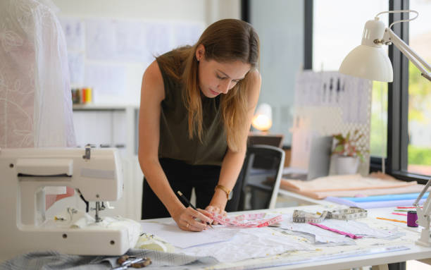 istock Happy female dressmaker working in workshop studio 1471484047
