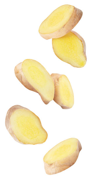 istock IsIsolated ginger pieces in the air. Raw ginger slices falling down isolated on white background with clipping path 1471484658