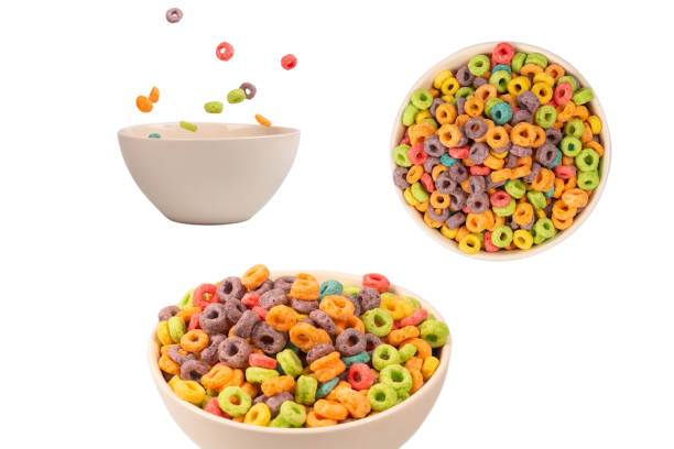 istock Colorful rings cereal spill out into a bowl. Breakfast. Isolated. 1471487638