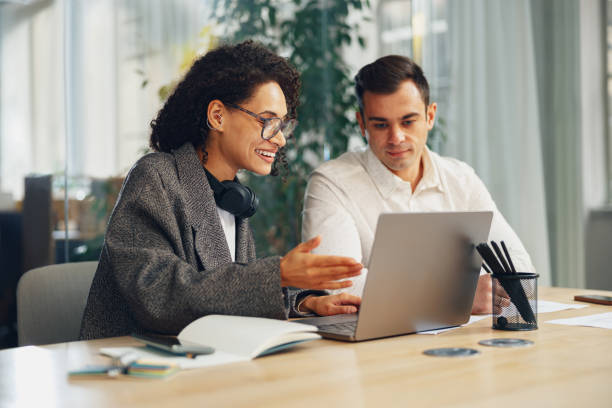 istock Businesspeople working together on new project in modern office. Teamwork concept 1471491208
