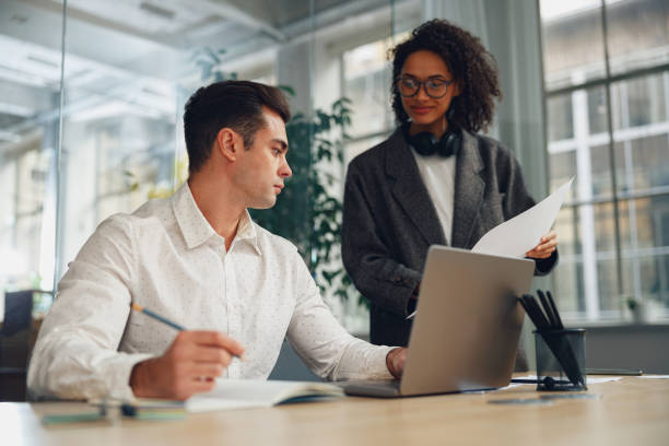 istock Female secretary brought documents to the boss for signing during working day 1471491361