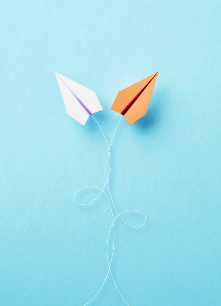 istock Paper Planes Flying On Different Directions On Blue Background 1471492714