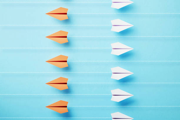 istock Paper Planes Flying On Different Directions On Blue Background 1471493088