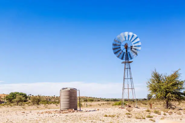 Windmill water pump in desert area in Kgalagadi transfrontier park, South Africa