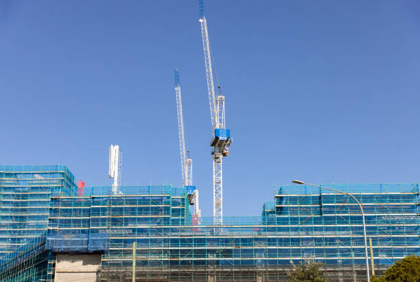 istock Construction of modern apartment buildings, background with copy space 1471499068