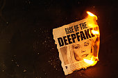 Burning newspaper clipping about deepfakes