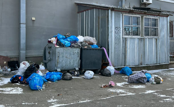 istock Overfilled garbage bins with rubbish bags 1471503219