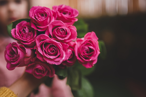 close up of a bouquet of pink roses with copy space.