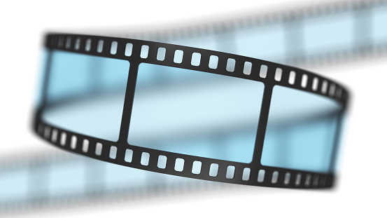 Film reel. Cinema or photography 35mm film strip tape. 3d illustration isolated on the white background.