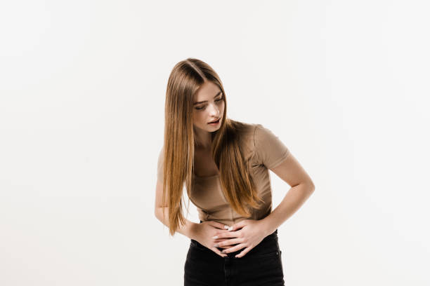 Stomach pain. Pancreatitis disease of pancreas becomes inflamed. Sick attractive girl hold abdomen because it hurts. Stomach pain. Pancreatitis disease of pancreas becomes inflamed. Sick attractive girl hold abdomen because it hurts endometriosis bloated stock pictures, royalty-free photos & images