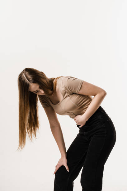 Violation of menstrual cycle in young woman. Algo dysmenorrhea. Menstruation and pain during menstruation of girl. Violation of menstrual cycle in young woman. Algo dysmenorrhea. Menstruation and pain during menstruation of girl endometriosis bloated stock pictures, royalty-free photos & images