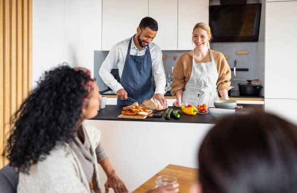 istock Small group of friends preparing food 1471507715