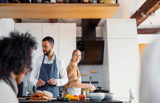 istock Small group of friends preparing food 1471507769