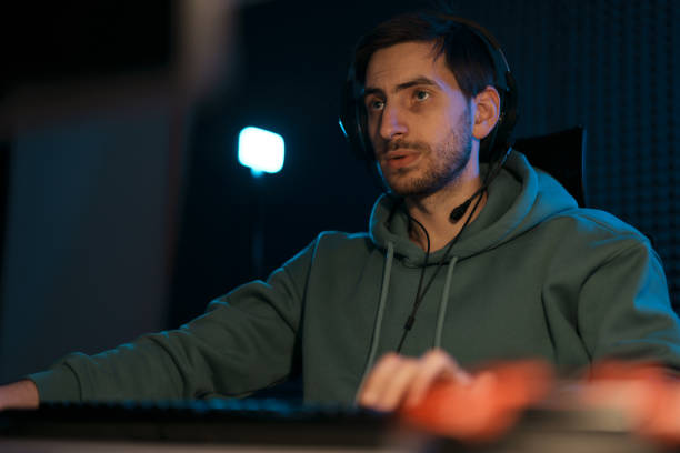 istock Male cybersport gamer playing computer game 1471510025
