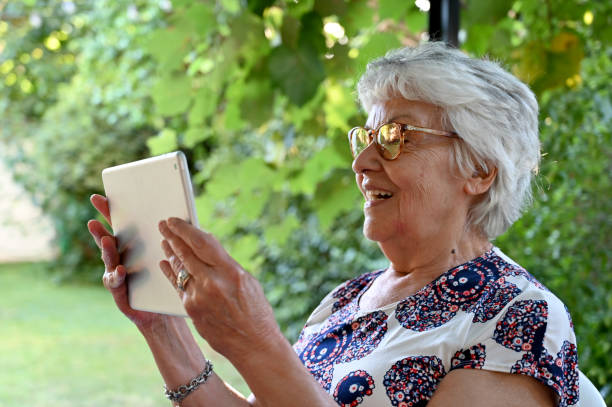 istock grandmother looking at a tablet 1471513980