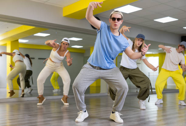 istock Young guy in sunglasses dancing modern dance 1471517346