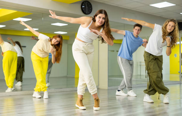 istock Young girl training breakdance Toprock moves in dance hall 1471517439