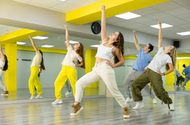 istock Young girl training breakdance Toprock moves in dance hall 1471517443