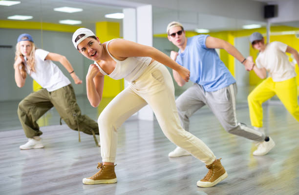 istock Teenage dancers, young people practicing modern dance styles together in spacious studio with mirrors 1471517538