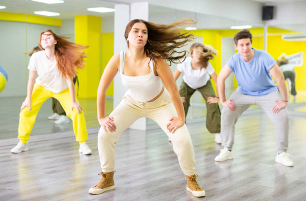 istock Happy heenagers in dance hall studying new movements, smiling and having fun 1471517698