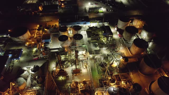 Aerial view of oil refinery facility terminal. Industrial factory for produce and storage of crude oil and petrochemicals for oil energy and power manufacturing products. Industrial plant.