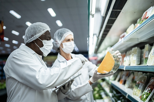 Inspectors analyzing the food in the supermarket