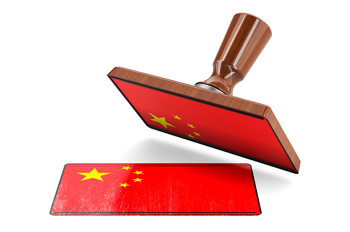 Wooden stamper, seal with Chinese flag, 3D rendering isolated on white background