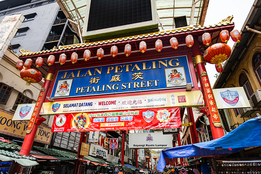 Kuala Lumpur, Malaysia - December 2022: Chinatown in Kuala Lumpur at  the main gate of famous Petaling Street.