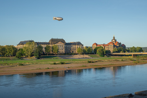 Frankfurt, Germany – September 24, 2021: An airship on a sightseeing flight over Frankfurt. The Zeppelin NT - New Technology - is developed and based in Friedrichshafen on Lake Constance.