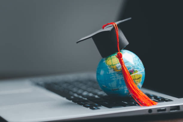 Graduation cap with Earth globe. Concept of global business study, abroad educational, Back to School. Education in Global world, Study abroad business in universities in worldwide. language study stock photo