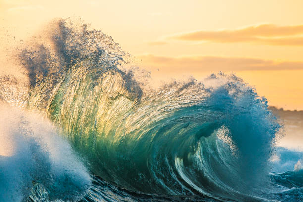 istock Powerful display of ocean waves colliding creating pattern in early morning golden light 1471529655