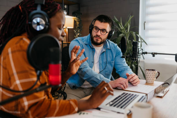 istock Two young podcasters enjoying their job 1471529813