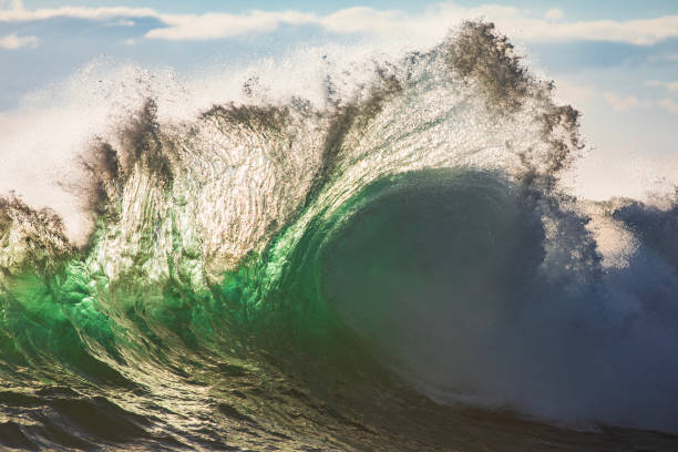 istock Powerful display of ocean waves colliding creating pattern in early morning golden light 1471529836