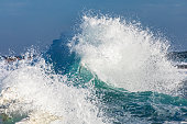 istock Unique display of ocean waves colliding creating pattern in morning light 1471529859
