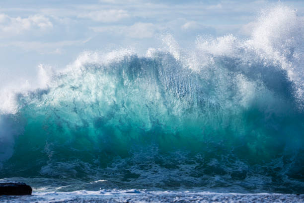 istock Powerful display of ocean waves colliding creating pattern in morning light 1471529874