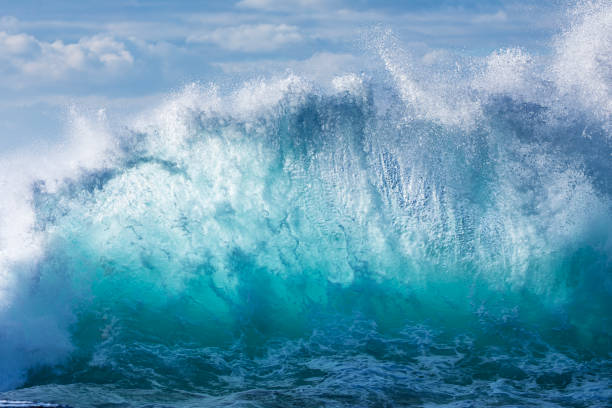 Watching Large Wave Waimea Bay North Shore Oahu Hawaii. Waimea Bay is famous for big wave surfing. On this day, waves were 15 to 20 feet high.