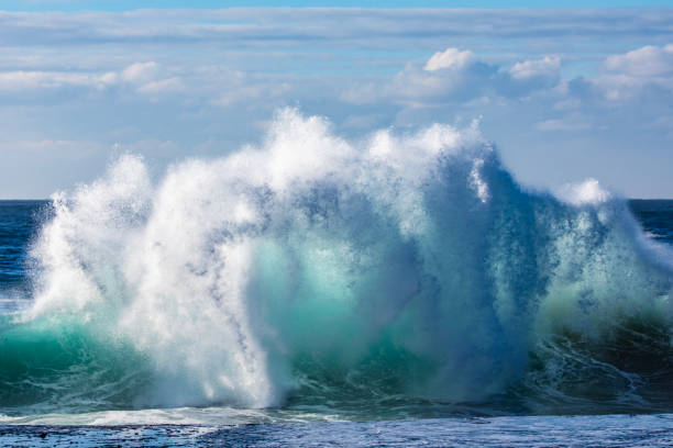 istock Powerful display of ocean waves colliding creating pattern in morning light 1471529878